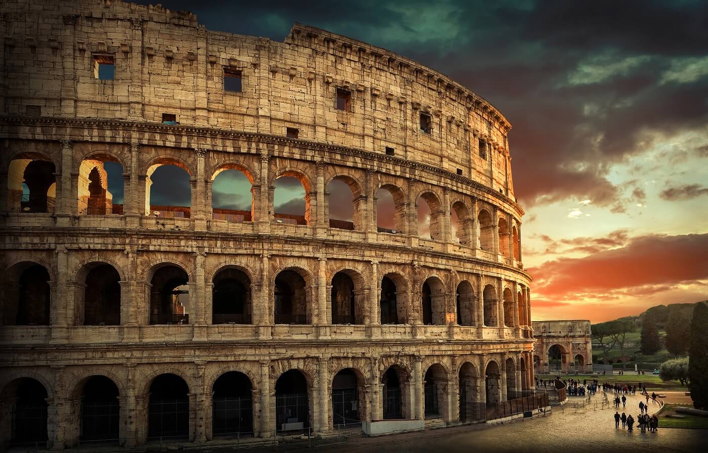 One of the most popular travel place in world – Roman Coliseum under evening sun light and sunrise sky.