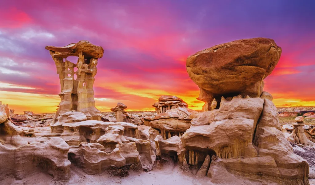 rock formations in the desert at sunset