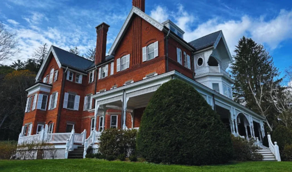 a large red brick house with white trim